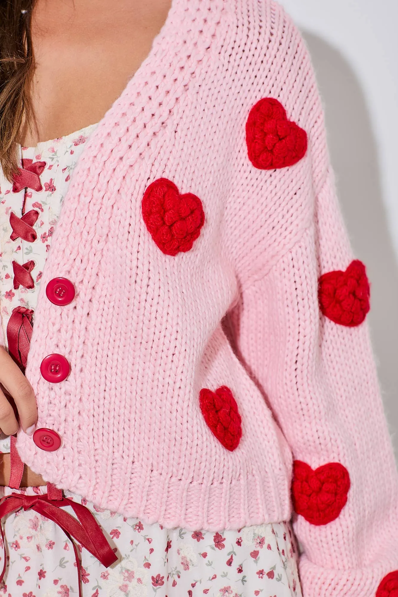 PINK KNITTED CARDIGAN WITH RED BUBBLE HEART DETAIL