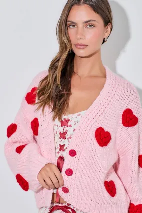 PINK KNITTED CARDIGAN WITH RED BUBBLE HEART DETAIL